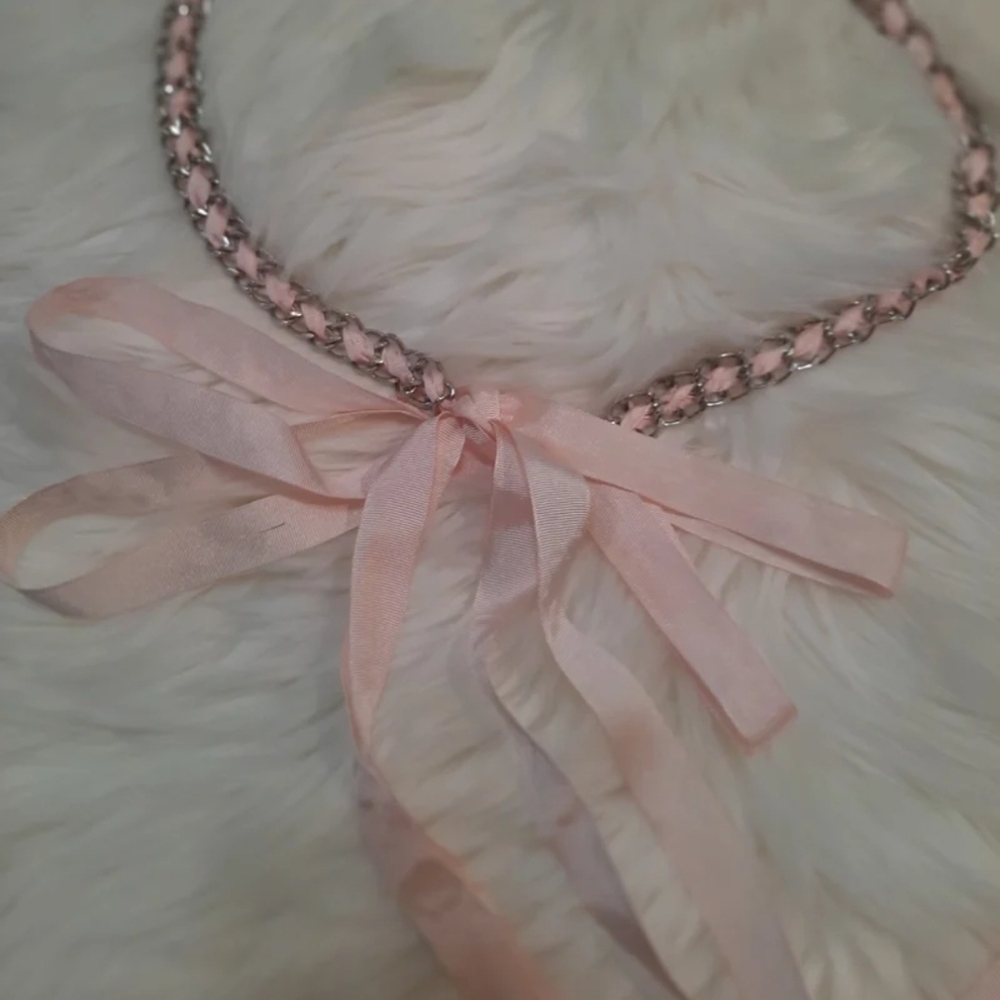 Vintage style silver chain belt with pink ribbon ties.